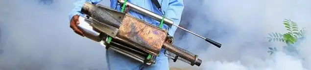 Fumigation technician using a fogger for deep pest treatment in Columbus, OH